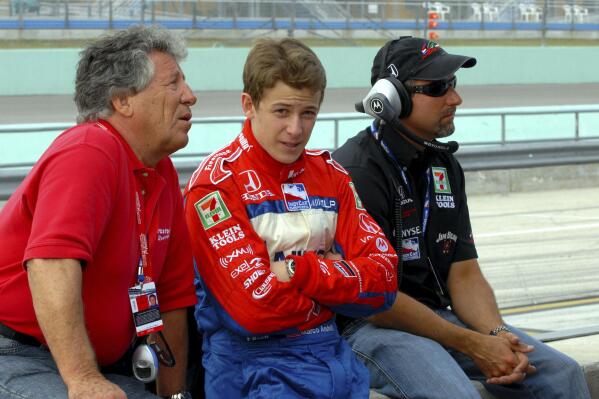 FILE - Mario Andretti, left, his grandson Marco, center, and son Michael are shown during the Toyota Indy 300 practice session at Homestead-Miami speedway in Homestead, Fla., in this Friday, March 24, 2006, file photo. Marco Andretti made the decision at the start of this year to step away from full-time racing and essentially end three generations of the most famous family in motorsports competing at the highest level. (AP Photo/Paul Kizzle, File)