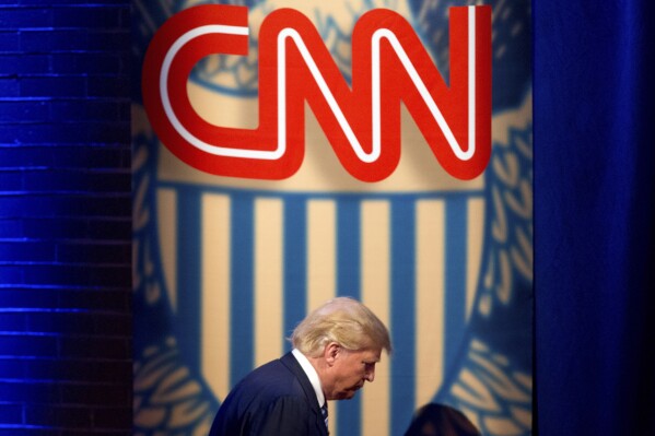 FILE - Then-Republican presidential candidate Donald Trump arrives for a CNN town hall at the University of South Carolina in Columbia, S.C., Feb. 18, 2016. A federal judge has dismissed a lawsuit Trump filed against CNN in which the former U.S. president claimed that the network's referring to his efforts to overturn the 2020 election as “the Big Lie” was tantamount to comparing him to Adolf Hitler. Trump had been seeking punitive damages of $475 million in the lawsuit filed last October. (AP Photo/Andrew Harnik, file)