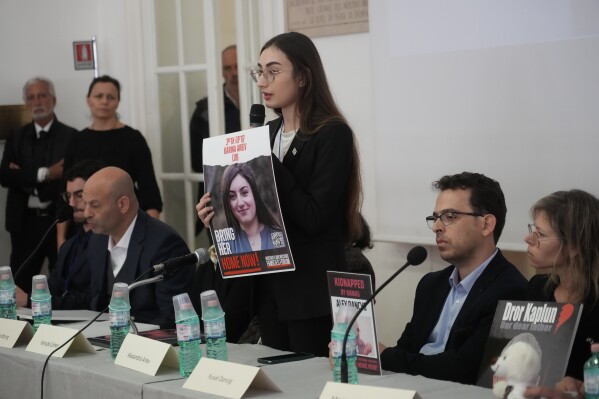 Alexandra Ariev, center, speaks during a press conference at the Italian Jewish Center in Rome, Wednesday, Nov. 22, 2023, with other representatives of the families of the Israelis abducted by Hamas on Oct. 7 and believed to be held hostages in Gaza, shortly after they met with Pope Francis at The Vatican. Ariev, an Israeli soldier, was abducted by Hamas militants from her base during her mandatory military service during the militant group's unprecedented attack on Israel on Oct. 7 that resulted in the killing of 1,400 people and the abduction of over 220. (AP Photo/Gregorio Borgia)