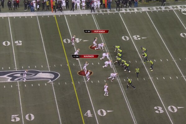 This photo provided by Prime Video shows a play during an NFL football game between the San Francisco 49ers and Seattle Seahawks, Dec. 15, 2022, in Seattle. The photo highlights San Francisco linebacker Fred Warner and safety Talanoa Hufanga as players who might rush Seattle quarterback Geno Smith. Prime Video will have a feature on its Prime Vision featuring Next Gen Stats broadcast of 