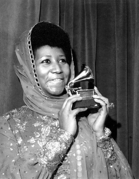 
              FILE - In this March 3, 1975 file photo, singer Aretha Franklin poses with her Grammy Award for for best female R&B vocal performance for "Ain't Nothing Like the Real Thing" at the 17th Annual Grammy Award presentation in New York.   Franklin died Thursday, Aug. 16, 2018 at her home in Detroit.  She was 76. (AP Photo, File)
            