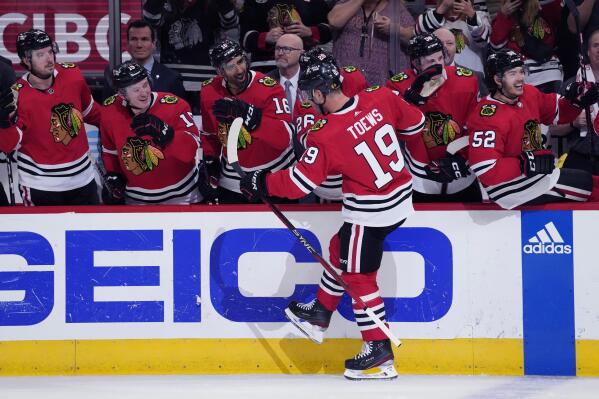 Chicago Blackhawks center Jonathan Toews (19) celebrates with teammates after scoring a goal during the second period of an NHL hockey game against the Philadelphia Flyers in Chicago, Thursday, April 13, 2023. (AP Photo/Nam Y. Huh)
