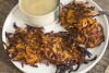 This image provided by Katie Workman shows apple sauce and ginger sweet potato pancakes. Traditional Hanukkah latkes are pancakes made from white potatoes and simply seasoned with salt, pepper and onion. But nowhere is it written that you can't play around with that. APfood writer Katie Workman suggests a recipe for ginger sweet potato pancakes as a variation on traditional latkes. (Katie Workman via 麻豆传媒app)