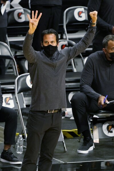 Miami Heat head coach Erik Spoelstra gestures during the first half of an NBA basketball game against the Detroit Pistons, Monday, Jan. 18, 2021, in Miami. (AP Photo/Marta Lavandier)