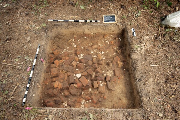 This image provided by Colonial Williamsburg Foundation, shows bricks that were believed to be part of military barracks during the American Revolution at an archaeological dig at Colonial Williamsburg, Va. The museum announced the site’s discovery on Tuesday, May 14, 2024. (Colonial Williamsburg Foundation via AP)