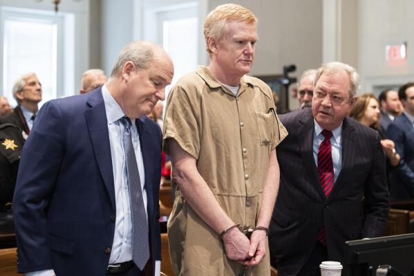 Alex Murdaugh speaks with his legal team before he is sentenced to two consecutive life sentences for the murder of his wife and son by Judge Clifton Newman at the Colleton County Courthouse on Friday, March 3, 2023 in in Walterboro, S.C. (Joshua Boucher/The State via AP, Pool)
