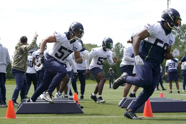 Seahawks OTAs have different feel with no Wilson, Wagner