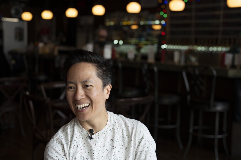 The Sports Bra founder and CEO Jenny Nguyen laughs during an interview with the Associated Press at the sports bar on Thursday, April 25, 2024, in Portland, Ore. (AP Photo/Jenny Kane)