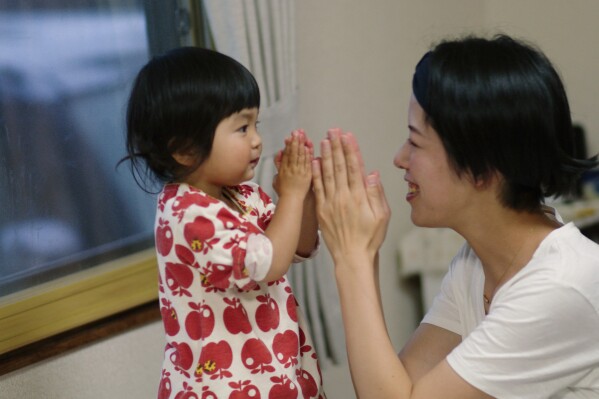 This photo provided by Japan Media Services shows a scene from The Ones Left Behind: The Plight of Single Mothers in Japan, directed by Rionne McAvoy. The award-winning independent documentary film released in 2023 tells the story of single mothers in Japan, weaving together interviews with the women and experts, and showing the other side of a culture whose ideal is for women to get married and become stay-at-home housewives and mothers. (Japan Media Services via AP)