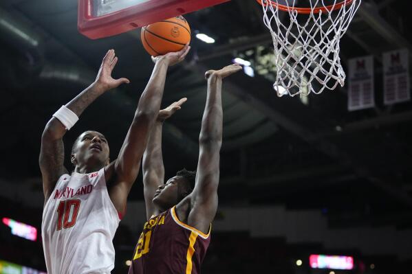 Maryland forward Julian Reese (10) goes up for a shot against Minnesota forward Pharrel Payne (21) during the second half of an NCAA college basketball game, Wednesday, Feb. 22, 2023, in College Park, Md. Maryland won 88-70. (AP Photo/Julio Cortez)