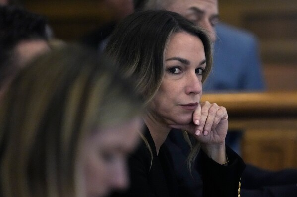 Karen Read listens to testimony during her trial at Norfolk County Superior Court, Friday, May 17, 2024, in Dedham, Mass. Read, 44, is accused of running into her Boston police officer boyfriend with her SUV in the middle of a nor'easter and leaving him for dead after a night of heavy drinking. (AP Photo/Charles Krupa, Pool)
