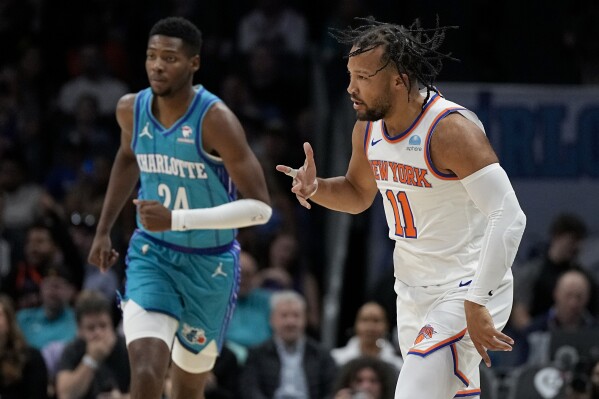 New York Knicks guard Jalen Brunson celebrates after scoring against the Charlotte Hornets during the first half of an NBA basketball game on Saturday, Nov. 18, 2023, in Charlotte, N.C. (AP Photo/Chris Carlson)