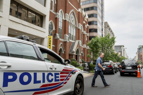 A Washington police vehicle sits outside the Metropolitan African Methodist Episcopal Church in Washington, June 19, 2015. (AP Photo/Andrew Harnik)