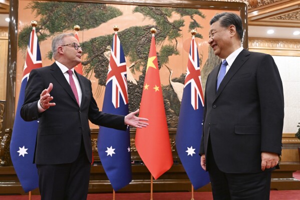 Australia's Prime Minister Anthony Albanese, left, gestures as he meets with China's President Xi Jinping at the Great Hall of the People in Beijing, China, Monday, Nov. 6, 2023. Albanese is on a three-day visit to China. (Lukas Coch/AAP Image via AP)