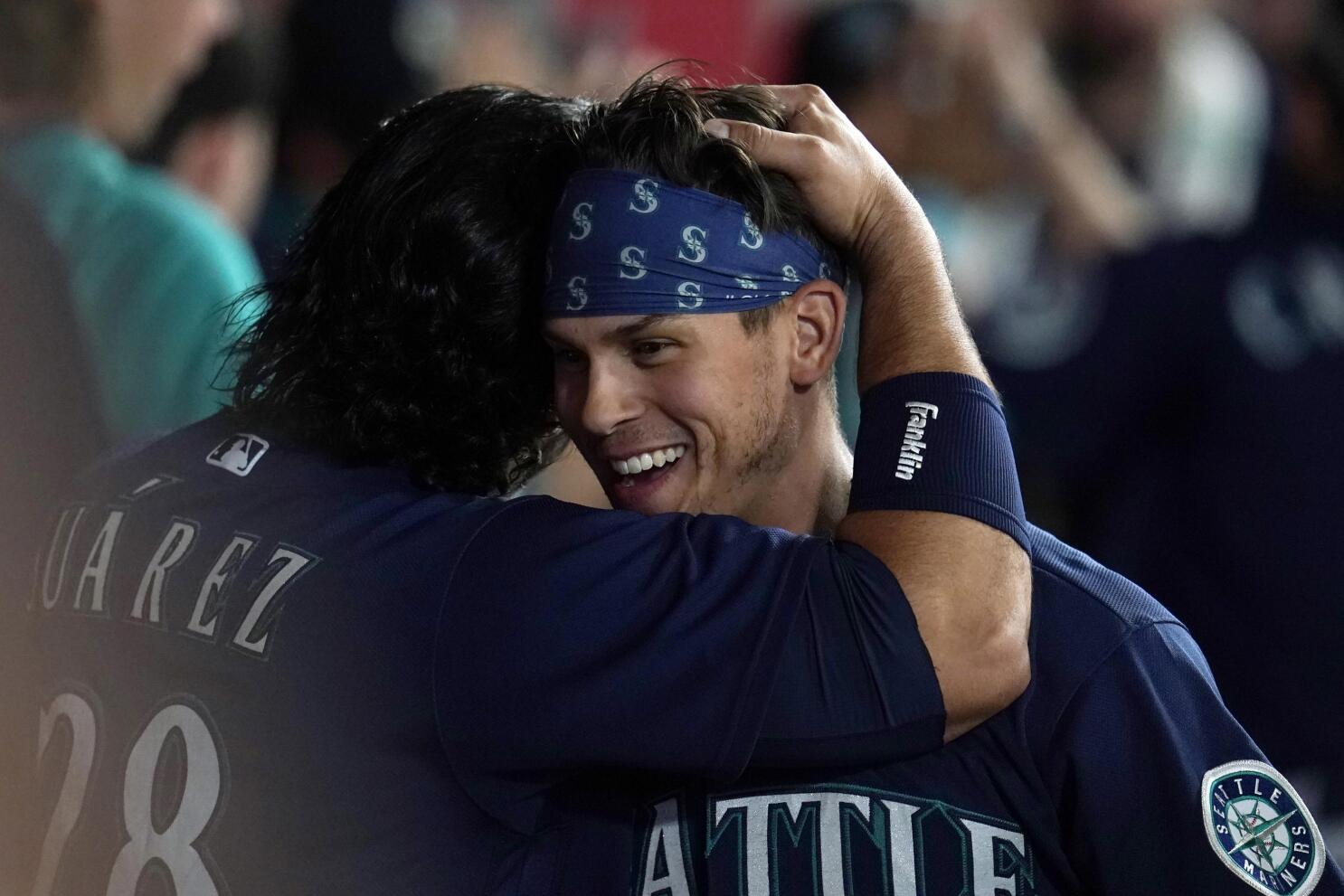 Sam Haggerty and Julio Rodriguez of the Seattle Mariners smile as