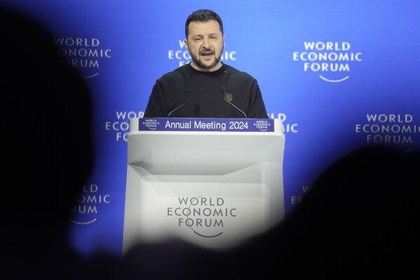 Ukrainian President Volodymyr Zelenskyy delivers his speech at the Annual Meeting of World Economic Forum in Davos, Switzerland, Tuesday, Jan. 16, 2024. The annual meeting of the World Economic Forum is taking place in Davos from Jan. 15 until Jan. 19, 2024.(AP Photo/Markus Schreiber)