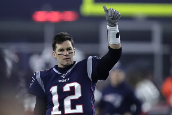 New England Patriots quarterback Tom Brady signals to a teammate before an NFL wild-card playoff football game against the Tennessee Titans, Saturday, Jan. 4, 2020, in Foxborough, Mass. (AP Photo/Charles Krupa)