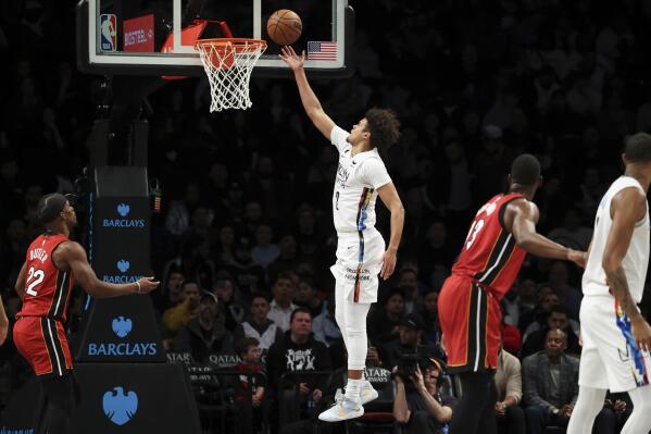 Miami Heat forward Jimmy Butler (22) dunks as Brooklyn Nets guard