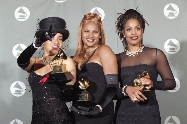 FILE - Salt N' Pepa display the awards they won for Best Rap Duo or Group Performance backstage at the 37th annual Grammy Awards at the Shrine Auditorium in Los Angeles, Calif., March 1, 1995. Women have fought to shape their identification in hip-hop and demand recognition. At its 50th anniversary, female rappers are taking their moment to shine – while still demanding respect and facing decades-old challenges. (AP Photo/Mark J. Terrill, File)
