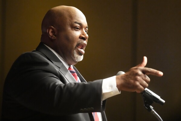 North Carolina Lt. Gov. Mark Robinson, Republican candidate for governor, speaks at an election night event in Greensboro, N.C., Tuesday, March 5, 2024. (AP Photo/Chuck Burton)