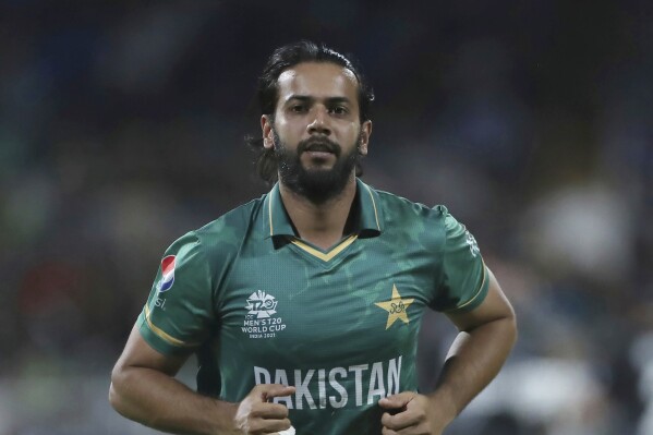 FILE- Pakistan's Imad Wasim runs to take his fielding position at the boundary during the Cricket Twenty20 World Cup match between New Zealand and Pakistan in Sharjah, UAE, Tuesday, Oct. 26, 2021. Pakistan allrounder Imad Wasim has retired from international cricket. The 34-year-old Wasim made the announcement on X, formerly known as Twitter, on Friday, Nov. 24, 2023. (AP Photo/Aijaz Rahi, File)