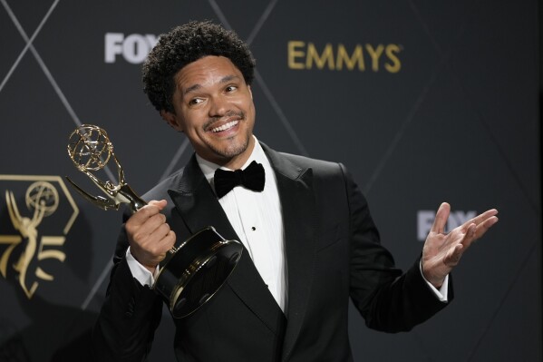 FILE - Trevor Noah, winner of the award for outstanding variety talk series for "The Daily Show With Trevor Noah," poses in the press room during the 75th Primetime Emmy Awards on Monday, Jan. 15, 2024, in Los Angeles. Noah will host the 2024 Grammy Awards on Feb. 4. (AP Photo/Ashley Landis, File)
