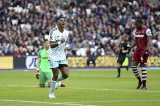 Nottingham Forest's Taiwo Awoniyi celebrates after scoring their sides first goal during the English Premier League soccer match between West Ham United and Nottingham Forest at the London Stadium, London, Sunday, Nov. 12, 2023. (Nigel French/PA via AP)