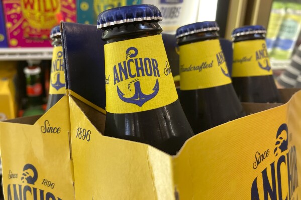 FILE - A pack of Anchor Brewing Co. steam beer is photographed at a store in San Francisco, Wednesday, July 12, 2023. Craft beer pioneer Anchor Brewing Co. has been purchased by Chobani yogurt founder and billionaire Hamdi Ulukaya. The billionaire said in a news announcement Friday, May 31, 2024, that he is excited to be part of the company's rebirth in San Francisco. (AP Photo/Jeff Chiu,File)