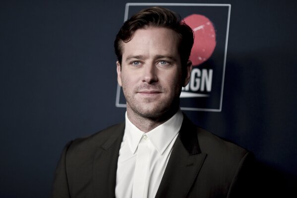FILE - Armie Hammer attends the 13th Annual Go Gala on Nov. 16, 2019, in Los Angeles. Los Angeles police said Thursday, March 18, 2021, that they are investigating actor Armie Hammer for sexual assault. His attorney denies the allegation. A police spokesman says Hammer is the main suspect in an incident reported on Feb. 3. (Photo by Richard Shotwell/Invision/AP, File)