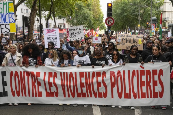 People march with a banner that reads, "against police violences," in Paris, Saturday, Sept. 23, 2023. Activists from community groups, far-left parties and unions have held marches around France against racism and police brutality. (AP Photo/Michel Euler)