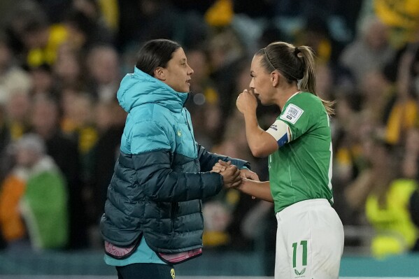Australia's Sam Kerr, left, shakes hands with Ireland's Katie McCabe at the end of the Women's World Cup soccer match between Australia and Ireland at Stadium Australia in Sydney, Australia, Thursday, July 20, 2023. Australia won 1-0. (AP Photo/Mark Baker)