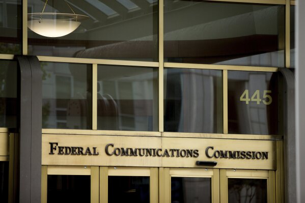 FILE - This June 19, 2015, file photo, shows the Federal Communications Commission building in Washington. The Federal Communications Commission on Friday, Feb. 28, 2020, is proposing about $200 million in fines combined for the four major U.S. phone companies for improperly disclosing customers' real-time location. Location data makes it possible to identify the whereabouts of nearly any phone in the U.S.  (AP Photo/Andrew Harnik, File)