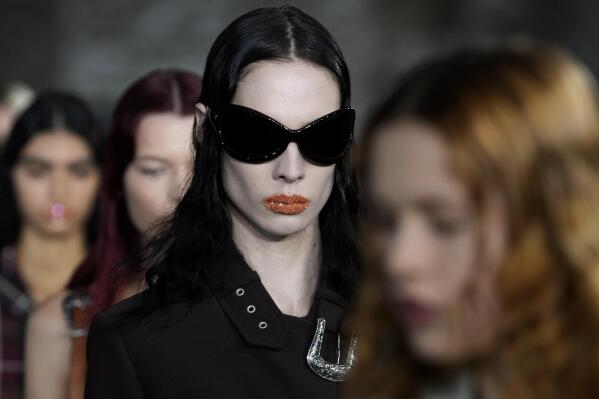 Models wear creations for Acne Studios Spring-Summer 2022 ready-to-wear fashion show presented Wednesday, Sept. 29, 2021, in Paris. (AP Photo/Christophe Ena)