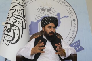 Molvi Mohammad Sadiq Akif, the spokesman for the Taliban's Ministry of Vice and Virtue, speaks during an interview in Kabul, Afghanistan, Thursday, Aug. 17, 2023. Molvi said that women lose value if their faces are visible to men in public and that the only way to wear the hijab, or the Islamic headscarf, is if the face is hidden. (AP Photo/Siddiqullah Alizai)