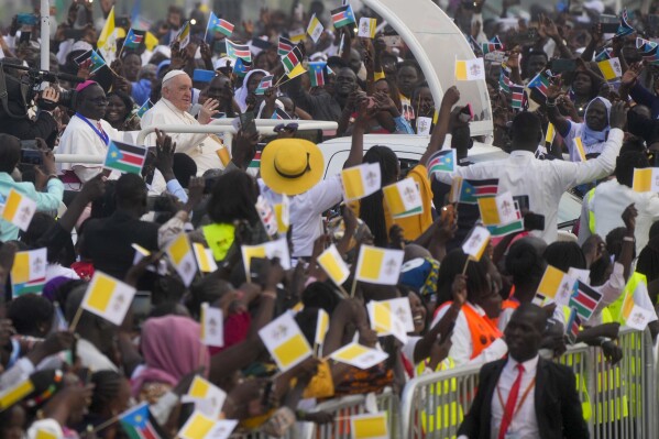 FILE - Pope Francis arrives to celebrate mass at the John Garang Mausoleum in Juba, South Sudan, Sunday, Feb. 5, 2023. Catholics around the world are sharply divided by Francis’ December 2023 declaration giving priests more leeway to bless same-sex couples. (AP Photo/Gregorio Borgia, File)
