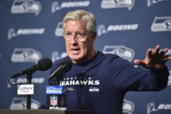 Seattle Seahawks head coach Pete Carroll talks to reporters after a preseason NFL football game against the Chicago Bears, Thursday, Aug. 18, 2022, in Seattle. (AP Photo/Caean Couto)