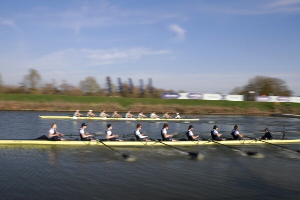 The Oxford, foreground, and Cambridge boats compete at the start of the Varsity Boat Race on the Great Ouse river at Ely in Cambridgeshire, England, Sunday April 4, 2021. (AP Photo/Ian Walton, Pool, File)