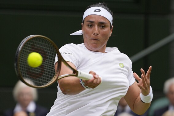 FILE - Tunisia's Ons Jabeur returns to Kazakhstan's Elena Rybakina in a women's singles match on day ten of the Wimbledon tennis championships in London, Wednesday, July 12, 2023. Jabeur is one of the women to watch at the U.S. Open, which begins at Flushing Meadows on Aug. 28. (AP Photo/Kirsty Wigglesworth, File)