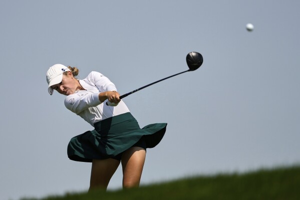 Chiara Tamburlini, of Switzerland, hits on the 12th hole during the third round of the U.S. Women's Open golf tournament at Erin Hills Saturday, May 31, 2025, in Erin, Wis. (AP Photo/Matt York)