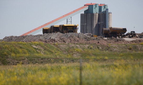 FILE - This Tuesday, July 2, 2019 file photo shows Eagle Butte mine in in Gillette, Wyo., following the closure of the Blackjewel mines.The coal industry was already hurting before the coronavirus. The pandemic has made things a lot worse. Production is down along with electricity demand, with office and school lights off across the nation.  (Josh Galemore/The Casper Star-Tribune via AP, File)