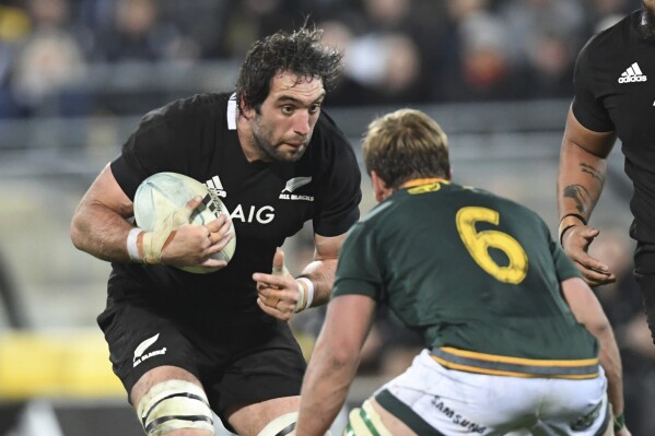 FILE - New Zealand's Sam Whitelock, left, eyes to eye with South Africa's Kwagga Smith during a Rugby Championship match between the All Blacks and South Africa in Wellington, New Zealand, Saturday, July 27, 2019. All Blacks lock Whitelock will retire from all rugby at the end of the current European season, aged 35 and after a record 153 tests for New Zealand. Whitelock’s decision came amid speculation of a recall to the New Zealand team. (AP Photo/Ross Setford, File)