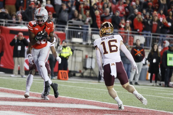 Henderson, McCord combine for 4 TDs as No. 3 Ohio State beats Minnesota  37-3 with Michigan up next