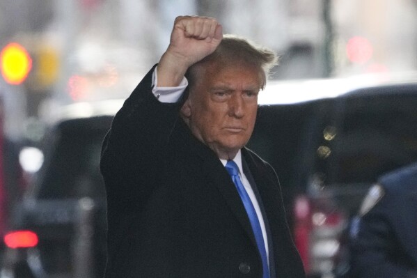 Former President Donald Trump leaves his apartment building in New York, Monday, Jan. 22, 2024. (AP Photo/Seth Wenig)