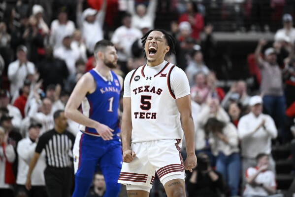 Texas Tech guard Darrion Williams (5) reacts after a score against Kansas during the second half of an NCAA college basketball game, Monday, Feb. 12, 2024, in Lubbock, Texas. (AP Photo/Justin Rex)