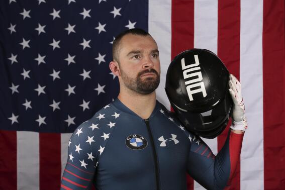 file- United States Olympic Winter Games bobsledder Carlo Valdes poses for a portrait at the 2017 Team USA Media Summit Tuesday, Sept. 26, 2017, in Park City, Utah. Five years since Holcomb was found dead in his room at the Olympic Training Center in Lake Placid, he is still felt within the program. “I definitely made my peace with him being gone a long time ago,” said Valdes, who used to push for Holcomb. “Now, it’s about how I can help people understand the type of person he was — especially the guys on the team now." (AP Photo/Rick Bowmer, File)