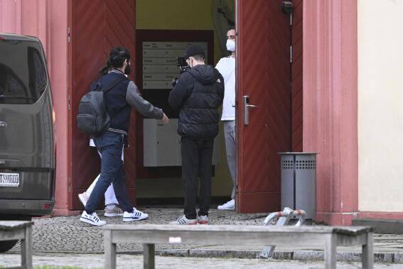 The former Real Madrid soccer player Isco, left, arrives for his medical check at the sports medicine department of the Charite in Berlin, Germany, Tuesday, Jan. 31, 2023. The Spanish soccer player is about to be signed by German Bundesliga club Union Berlin. (Matthias Koch/dpa via AP)