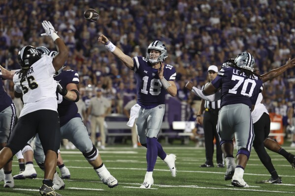 Kansas State quarterback Will Howard (18) throws a pass during the first half of an NCAA college football game against Central Florida on Saturday, Sept. 23, 2023, in Manhattan, Kan. (AP Photo/Travis Heying)