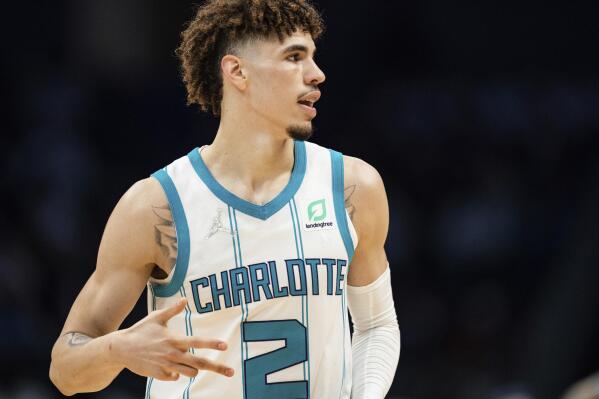 Charlotte Hornets guard LaMelo Ball reacts after making a shot against the Indiana Pacers during the second half of an NBA basketball game in Charlotte, N.C., Wednesday, Oct. 20, 2021. (AP Photo/Jacob Kupferman)