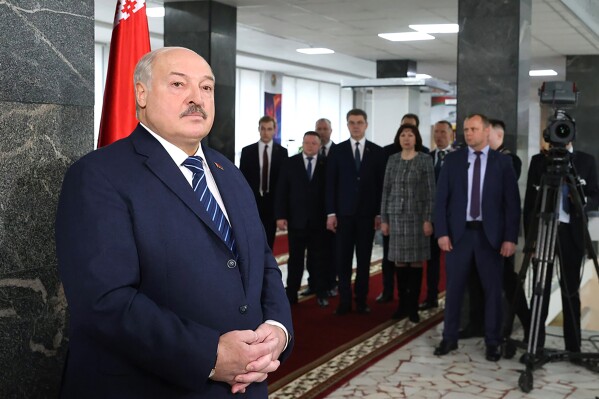 In this photo provided by the Belarusian Presidential Press Service, Belarus President Alexander Lukashenko addresses the media after voting at a polling station, in Minsk, Belarus, on Sunday, Feb. 25, 2024. Lukashenko was believed a few years ago to be considering whether to lead the new body after stepping down, but his calculus has apparently changed, and he announced on Sunday that he will run in next year's presidential election. (Belarusian Presidential Press Service via AP)