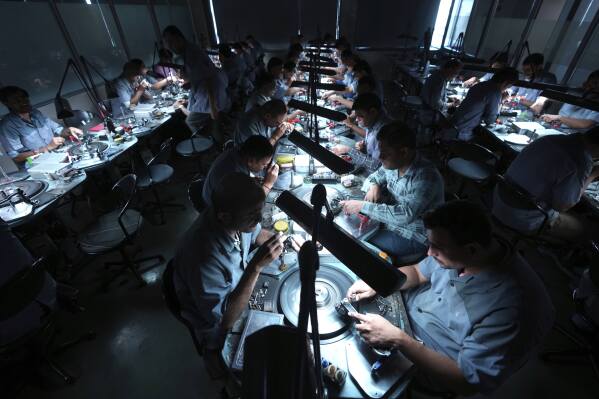 Employees cut and polish diamonds at Shree Ramkrishna Exports in Surat, India, on April 14, 2025. (AP Photo/Ajit Solanki)